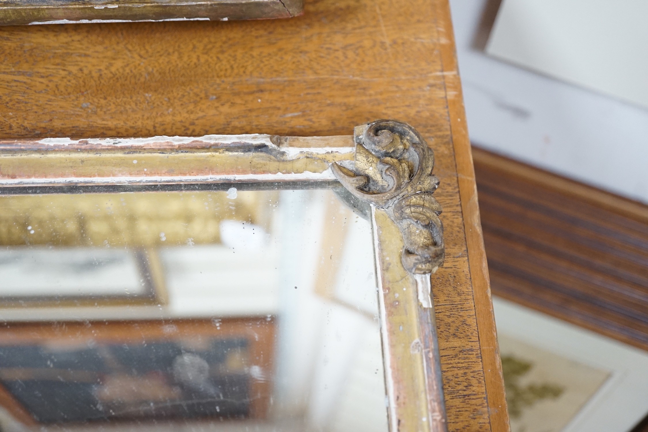 A gilt wooden mirror, 49cms wide, 40cm high